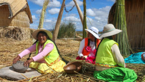 Uru women in traditional attire on the floating islands of Uros, Lake Titicaca