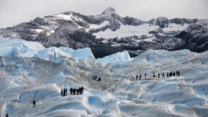 People hiking on Perito Moreno glacier in Argentina