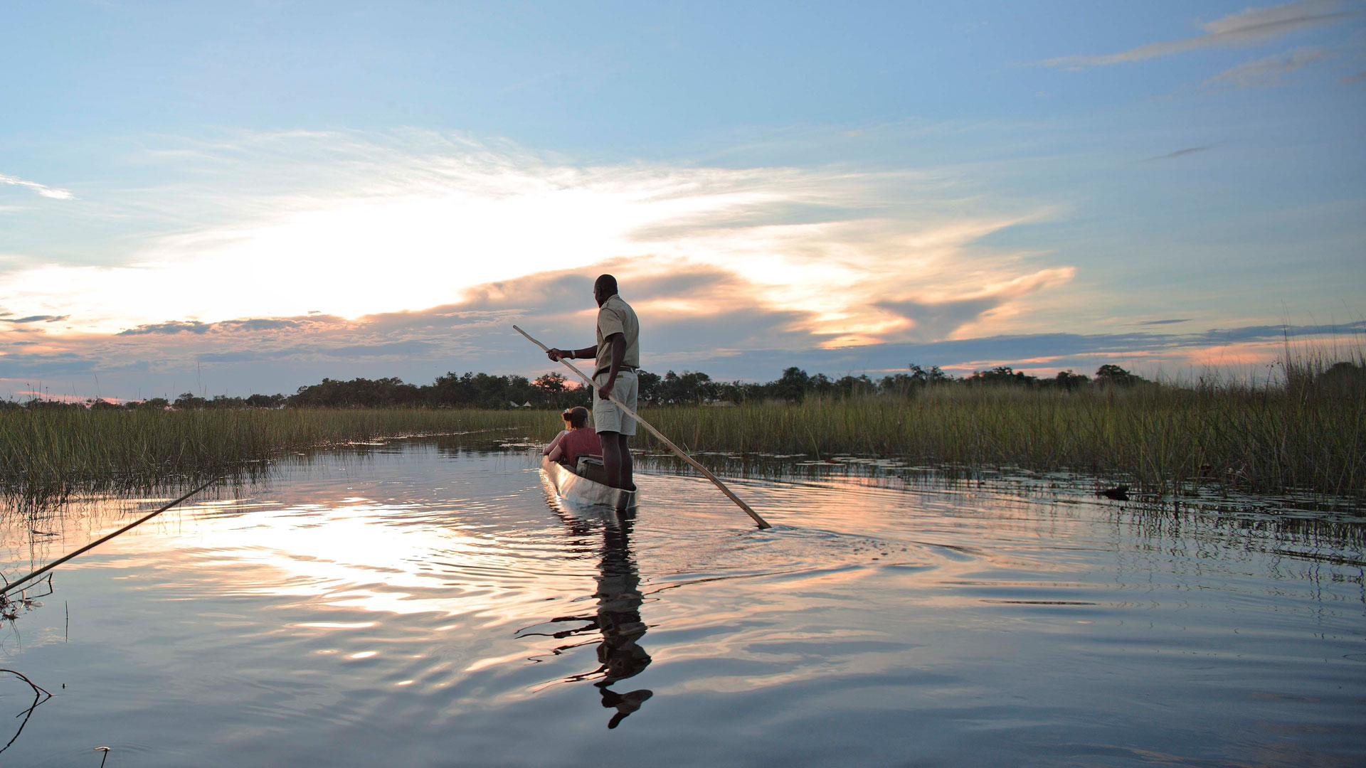 Gliding in a traditional mokoro in the Okavango Delta Maun