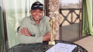 Aziza Mbwana with her trophy