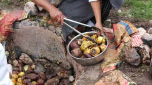 Traditional Peruvian dish pachamanca is cooked on rocks in the ground