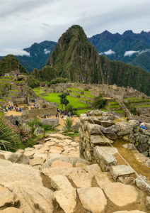 View of Machu Picchu citadel with close-up of stone paths