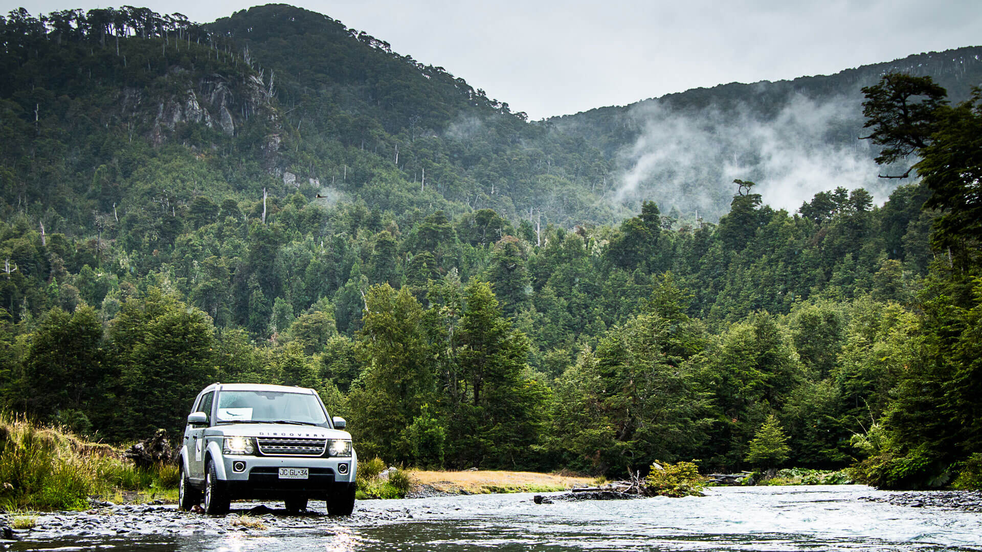 Land Rover crossing a river