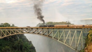 Train Crossing Famous Victoria Falls Bridge in Zimbabwe