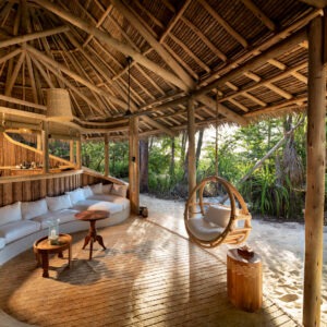 A view of the banda lounge at the &Beyond Mnemba Island Lodge, a private island retreat located off the northeast coast of Zanzibar, Tanzania.