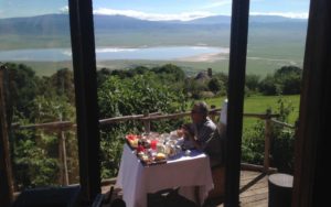 anthony bourdain enjoying breakfast and a view at andbeyond ngorongoro crater lodge