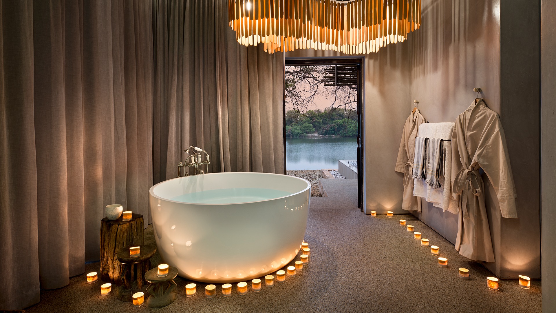 Bathroom With Candles Lit At Andbeyond Matetsi River Lodge At Andbeyond Matetsi River Lodge