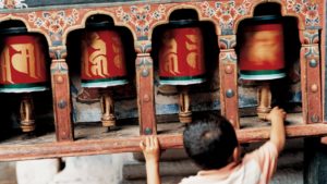 bhutan yoga uma como paro child prayer wheel