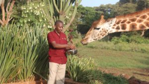 butler with bowl of food at giraffe manor