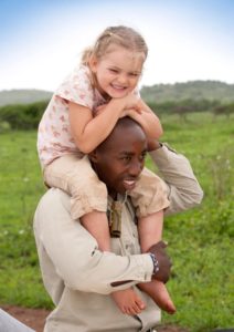 child on guides back on a africa safari