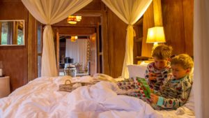 children reading safari stories at lake manyara wildchild programme