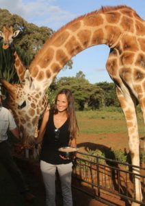 claire trickett feeding a giraffe at giraffe manor in nairobi kenya