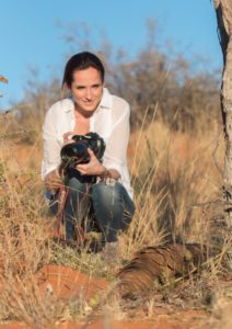 claire trickett looking at a pangolin in tswalu kalahari game reserve