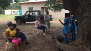 guests at andbeyond phinda interacting with local community kids