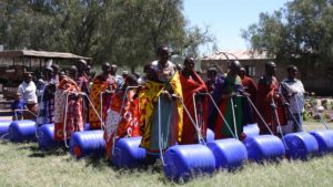 maasai ladies using hippo water rollers