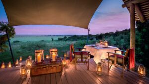 romantic lantern lit dining overlooking the masai mara at andBeyond bateleur camp