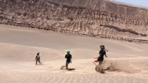 running down sand dunes in south america