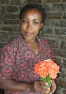 staff at andbeyond ngorongoro crater holding freshly cut roses